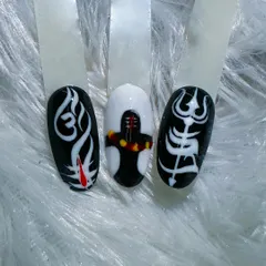 For Mahashivratri, we designed this powerful set of nail art. It features sacred symbols like the Om, the Shivling, and the Trishul, hand-painted in a bold black and white style to honor the occasion.