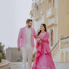 I believe couple portraits should feel natural and romantic. Here, I captured Anjali and Avanish taking a quiet walk during their Mehendi celebrations at a stunning Rajasthan palace, showcasing their connection in a timeless, elegant setting.