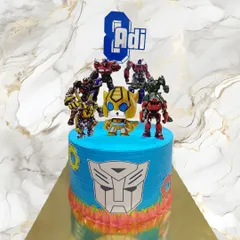 An action-packed Transformers cake for an 8th birthday celebration. The vibrant blue icing and character toppers bring the world of Autobots to life, all created with my signature fresh cream and no-fondant approach.
