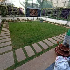 Another view of the courtyard, highlighting the impressive vertical garden walls. These "living walls" are a fantastic way to add a lot of greenery without taking up floor space.