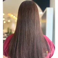 Another look at the flawless, glass-like shine achieved with our hair treatments, showing perfectly healthy and smooth strands.