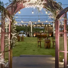 A Mehendi event is a canvas for creativity. We designed this modern Mehendi for Sonam and Ross with a "Til Death Do Us Party" neon sign, rustic-chic decor, and fairytale lighting, creating a fun and stylish atmosphere.