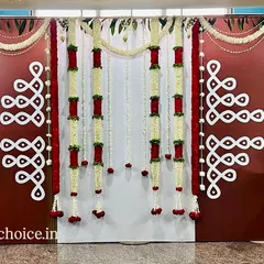 A classic traditional backdrop featuring kolam or rangoli patterns and garlands of jasmine and roses. This is perfect for any auspicious occasion at home.