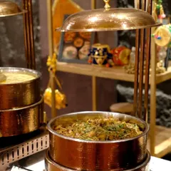 A main course buffet featuring our Subz Miloni in elegant copper chafing dishes, showcasing a setup fit for royalty.