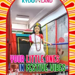 A little one dressed beautifully for Pujo, enjoying the festive vibes in our safe and fun play area.