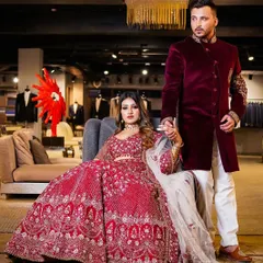 For this brand shoot, we created a scene of regal power. The composition, with the male model attending to the female lead, tells a story of luxury and partnership, perfectly showcasing this stunning red bridal lehenga in a high-end boutique setting.