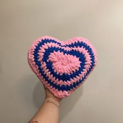 I love playing with color combinations for my heart pillows. This one features a fun pink and blue spiral design, adding a retro pop of color to your home decor.