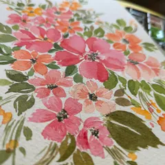 A close-up view of a loose floral watercolor piece. You can see the layers of color and the way the water blends the pigments to create soft, natural-looking petals. Each brushstroke is part of the story.