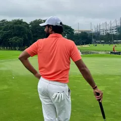 A moment of thought before a crucial putt. My on course coaching emphasizes reading the green, understanding the break, and committing to your line with confidence.