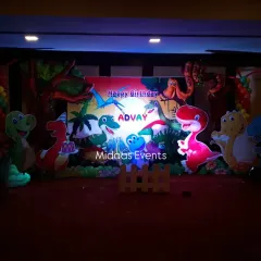 Lighting plays a crucial role in setting the mood. Here’s the same dinosaur backdrop under dramatic lighting, which highlights the colors and makes the characters pop, adding an extra layer of excitement to the evening celebration.