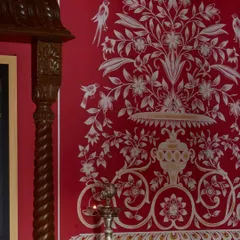 A close-up of the hand-painted motifs in the Hyderabad temple. The delicate birds and floral patterns, rendered with the subtle imperfections of the human hand, are what make the space feel so soulful. This is where bold design meets the quiet finesse of traditional craft.