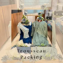 We believe a trousseau should be a work of art. Here, we've created an elegant display for the bride's outfits, using a beautiful wooden structure and delicate floral arrangements to turn her collection into a stunning showcase.
