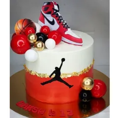 A stylish cake for a basketball fan, featuring the iconic Jordan logo and sneaker. This is an eggless black forest cake, perfect for a 13th birthday.