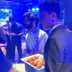 Our staff circulating with trays of freshly made starters at the Triumph showroom launch. This pass-around service is perfect for product launches and networking events where guests are mingling.