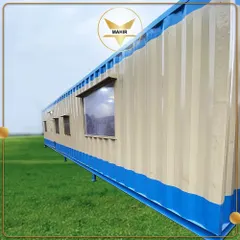 This 40-foot container, featuring an office, pantry, and bedroom, is shown installed on-site. We can place our structures on various foundations, including stilts like these, which are ideal for uneven terrain or specific site requirements.