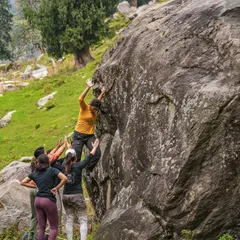 Another angle from our Sethan adventure, showing the collective effort involved in outdoor bouldering. Everyone plays a part, whether they're climbing, spotting, or offering encouragement from the side.