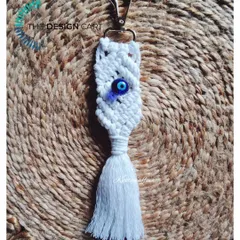 A trendy macrame evil eye keychain, which can also be used as a bag tag or charm. This one features a deep blue glass evil eye bead for a classic look.