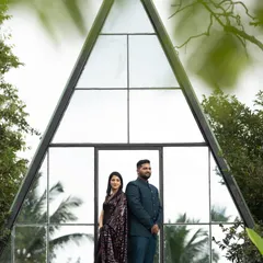 A dramatic pre-wedding shoot look. I created a more defined, glamorous makeup style for the bride to match her sequined saree and the architectural backdrop, while keeping the groom's look clean and sharp.