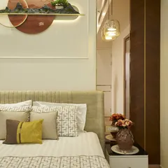 A closer look at the bedside details. The custom wall art, with its integrated lighting, acts as a beautiful and functional headboard feature.