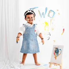 Let them be little and let them be messy! This fun paint-splatter theme for a second birthday shoot is all about capturing the pure, uninhibited joy of childhood creativity.