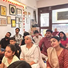 Students and music enthusiasts listening intently during the classical music workshop led by Pandit Devendra Verma.