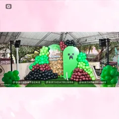 A view of the Minecraft backdrop and balloon decor before the character props were added, showing the foundational design.