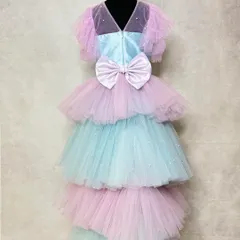 This mermaid-themed outfit is designed for both style and play. It features a beautiful playsuit with a detachable tiered tulle trail, allowing for a grand entrance and the freedom to party comfortably.