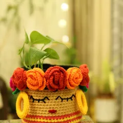 Meet my Frida Basket, a piece that is both bold and beautiful. I designed it to be a piece of art that also organizes your space, featuring an embroidered face and a crown of colourful roses. It’s perfect for holding a plant or keeping your favourite things tidy.