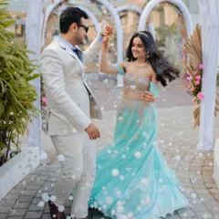 A happy couple dances amidst a shower of bubbles at their pre-wedding carnival, a fun and joyous event I designed to kick off the celebrations.