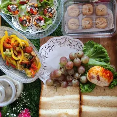 A leisurely breakfast spread perfect for a special morning, including sandwiches, fruit, cheese, and bite-sized appetizers like our Mexican tarts.