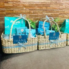 A pair of the turquoise-themed hampers I created for the jewelry brand Ivana by Jindals, showcasing their brand card prominently.
