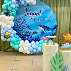 We can transform our space or yours with custom-themed decor. This "Under The Sea" setup for Jayant's 7th birthday featured a gorgeous balloon arch and backdrop, setting the stage for an aquatic art adventure.