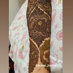 I love using roses as a central element in my bridal designs. Here, a large, shaded rose on the forearm is surrounded by intricate patterns, creating a romantic and classic bridal look.