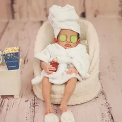 This little client is enjoying a moment of zen. The attention to detail, from the tiny drink to the alarm clock, makes these photos so special.