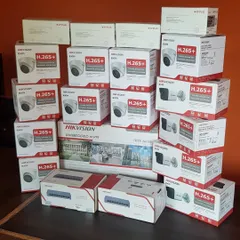 A complete IP camera system kit, including Hikvision dome and bullet cameras, an NVR, and PoE switches. Everything needed for a full setup.