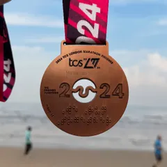 The 2024 TCS London Marathon finisher medal. This is one of the six iconic World Marathon Majors that our athletes train to conquer.