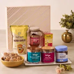 A healthy and gourmet corporate hamper featuring roasted almonds, trail mix, herb garlic crackers, and wild forest honey, perfect for health-conscious clients or teams.