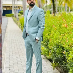 Another angle of the pastel suit against the lush greenery of Phuket. Style is all about the details.
