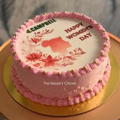 A lovely cake for a corporate Women's Day celebration, featuring the company logo and a beautiful themed design.
