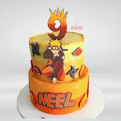 An adventurous Naruto-themed birthday cake to celebrate Neel’s big day! This completely no-fondant, two-tier cake in fiery orange and yellow is perfect for any young ninja fan who loves action and fun.