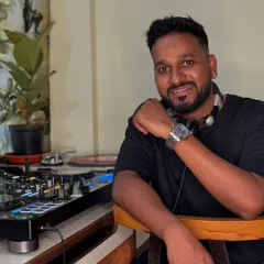 In my home studio, where I prepare new playlists and mixes for upcoming events. Every set is carefully curated to be fresh and exciting.