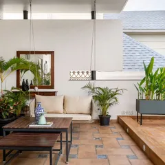 Another angle of the terrace lounge, showing how we use a mix of built-in planters and wooden decking to define the space and add warmth, creating a true outdoor living room.