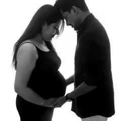 A beautiful and intimate silhouette. This black and white portrait, with your foreheads together, is a powerful and emotional image of your bond.