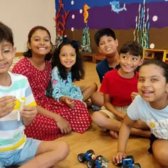 A group of friends enjoying their time at summer camp, surrounded by the cool projects they've been working on.