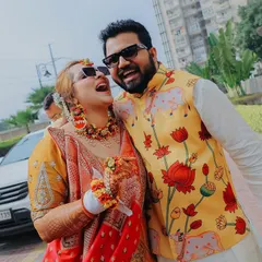 For me, the best shots are the unscripted ones. This candid photo from a Haldi ceremony captures a moment of pure, uninhibited laughter between the couple, showing the real fun and 'hasi-masti' of a wedding.