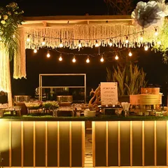 A beautifully decorated live station at an evening event, complete with ambient lighting. This setup housed our popular live dimsum and sushi counters.