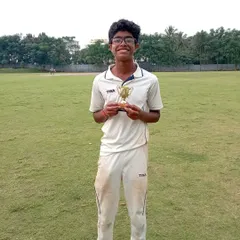 Celebrating a standout performance. This young player from our academy proudly holds his trophy after a successful match, showing the results of his hard work and training.