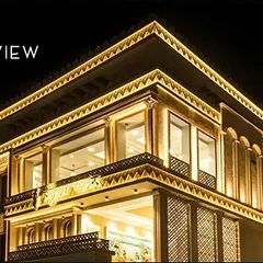 A demonstration of powerful facade lighting on a large commercial-style building. The automated system transitions the building's look from day to night, using Hybec lights to create a brilliant and impressive night view.