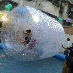 Water zorbing is an exciting activity where kids get inside a giant inflatable roller and walk on water. It is a unique attraction for any pool party.