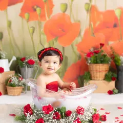 A lovely Valentine-themed milk bath with red roses and a poppy backdrop. This setup is perfect for capturing sweet and romantic photos of your little one.